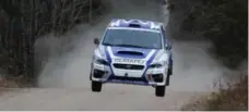  ?? GARY GRANT FOR THE TORONTO STAR ?? Antoine L’Estage and Alan Ockwell take flight in their Subaru at the 2014 Rally of the Tall Pines. This year’s event starts Saturday in Bancroft, Ont.