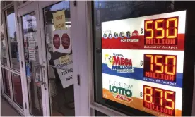  ?? Photograph: Wilfredo Lee/AP ?? Powerball and Mega Millions lottery jackpots are displayed on 13 January 2021 in North Miami Beach, Florida.