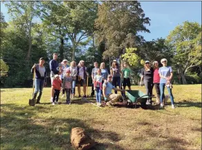  ?? Contribute­d photo ?? Volunteers helped the Darien Pollinator Pathway and the Department of Public Works plant about 30 native trees and shrubs in the town hall area on Oct. 2, 2021 in Darien.