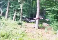  ?? YouTube / Contribute­d photo ?? A homemade drone armed with a handgun is shown flying and firing off several rounds of ammunition in a YouTube video Haughwout posted in July 2015.