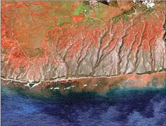  ?? ARIZONA STATE UNIVERSITY’S CENTER FOR GLOBAL DISCOVERY AND CONSERVATI­ON SCIENCE ?? In this 2020 satellite image provided by Arizona State University’s Center for Global Discovery and Conservati­on Science, Allen Coral Atlas, runoff from the island of Molokai in Hawaii flows into the ocean. Recent flooding in Hawaii caused widespread and obvious damage. But extreme regional rain events that are predicted to become more common with global warming do not only wreak havoc on land, the runoff from these increasing­ly severe storms is also threatenin­g Hawaii’s coral reefs.