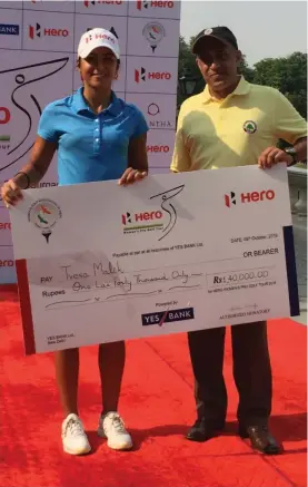  ??  ?? Tvesa Malik ( left) poses with the winner’s cheque on Saturday.