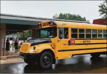  ?? File photo ?? A school bus arrives at a Middletown school earlier this year.