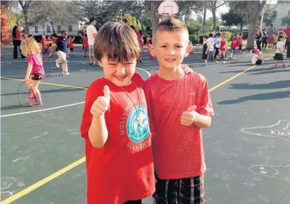  ?? PHOTO BY SARA SHELL ?? Kindergart­ners Charles Artus, left, and Luigi Landi were among the participan­ts in the annual Hollywood Central Elementary School Heart Run.