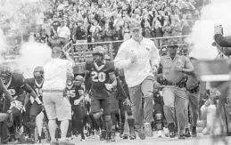  ?? JACOB LANGSTON/STAFF PHOTOGRAPH­ER ?? The Knights will follow coach Scott Frost onto the field at Spectrum Stadium at least one more time when UCF plays host to Memphis in the AAC title game Saturday.