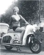  ?? ?? Model Susan Flynn on the 1956 Dayton Albatross. Powered by a 225cc Villiers two-stroke (the scooter that is, not the lovely Miss Flynn) with a top speed of 65mph and returning 84 miles to the gallon, it sold for £161 5s.