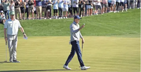  ?? PHOTOS BY ROB SCHUMACHER/THE REPUBLIC ?? Jordan Spieth reacts after making his par putt on the 18th hole Saturday during the third round of the Waste Management Phoenix Open at TPC Scottsdale.