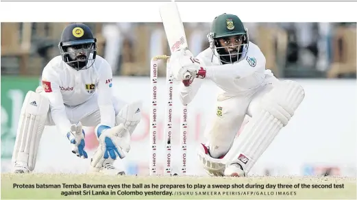  ?? /ISURU SAMEERA PEIRIS/AFP/GALLO IMAGES ?? Proteas batsman Temba Bavuma eyes the ball as he prepares to play a sweep shot during day three of the second test against Sri Lanka in Colombo yesterday.