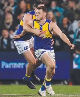  ??  ?? West Coast’s Luke Shuey became an instant hero with his match-winning goal after being awarded a free kick following a high tackle by Jared Polec (below left).