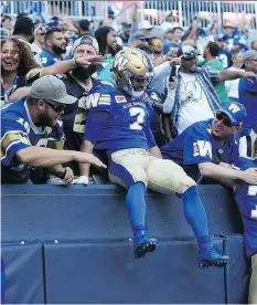  ??  ?? Weston Dressler celebrates a touchdown with Blue Bombers fans during the 2017 season. Dressler spent eight years with the Roughrider­s.