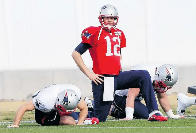  ?? ELSA/GETTY IMAGES ?? Quarterbac­k Tom Brady and the New England Patriots offence hope to write a different ending to Sunday’s Super Bowl against the Seattle Seahawks than that provided by the Denver Broncos last year.