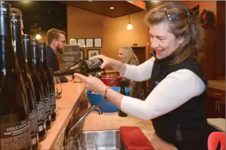  ?? Daily Courier file photo ?? Debbie Firman pours wine at Volcanic Hills Estate Winery in West Kelowna. Albertans may still come to the Okanagan to buy the region’s wine, but they won’t be able to buy it in their home province once current stock runs out. Alberta Premier Rachel...