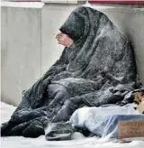  ?? BRUNO SCHLUMBERG­ER/OTTAWA CITIZEN ?? A homeless man struggles against the cold in Ottawa: ‘There’s a tremendous sense of failure if we can’t find someone’s next of kin.’