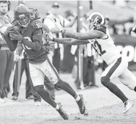  ?? Brett Coomer / Houston Chronicle ?? Texans receiver DeAndre Hopkins has mastered keeping both of his feet inbounds on a sideline catch, which the Rams’ Trumaine Johnson can verify.