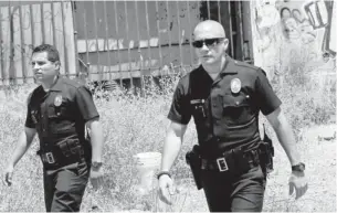  ?? SCOTT GARFIELD, OPEN ROAD FILMS ?? In End of
Watch, Jake Gyllenhaal, right, plays an LAPD officer in South Central L.A. Michael Peña is alongside as partner and best friend.