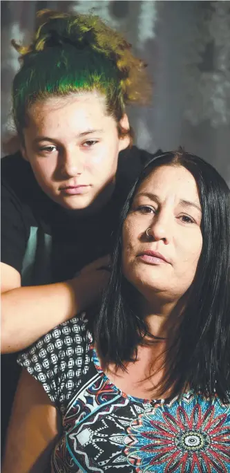  ?? SHOCKING ATTACK: Mel Rouvray and daughter Ruby Rouvray, 13, whose dog Cookie was mauled to death by their neighbour’s dogs on Friday. Picture: SCOTT RADFORD- CHISHOLM ??