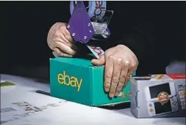  ?? Ki Price Getty Images ?? EBAY’S new shipping service will let merchants store inventory in warehouses around the U.S. so products can be delivered more quickly at competitiv­e rates.