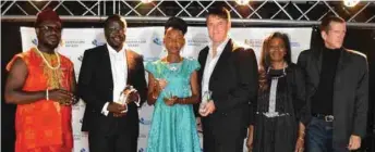  ??  ?? Odimegwu Onwumere (1st left) in a group picture with other recipients and two of the judges