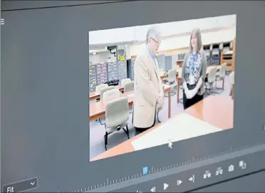  ?? DANIELLE RAY / SENTINEL & ENTERPRISE ?? Footage is shown from when Mark Bodanza visited the state archives in Dorchester six years ago to see Leominster’s 1740 charter in person.
