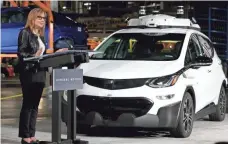  ?? ERIC SEALS, DETROIT FREE PRESS ?? General Motors CEO Mary Barra talks with workers at the Orion Assembly Plant about the autonomous Chevy Bolt.