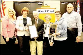  ??  ?? Bill and Marietta Morris, center, received the 2017 Bud Cox award, presented by Lincoln Area Chamber of Commerce.