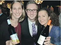  ??  ?? Blasted Church’s Danielle Andrews, left, and Howling Bluff’s Vicky Ainley, right, uncorked their finest bottles with QMUNITY’s Jeffrey Preiss at Stack the Rack, a benefit for BC’s Queer Resource Centre.