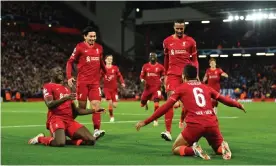  ?? Photograph: Andrew Powell/Liverpool FC/Getty Images ?? Thiago Alcântara celebrates with his Liverpool teammates after his long-range strike broke the deadlock at Anfield.