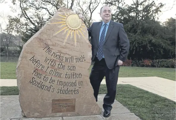  ?? PICTURE: KATIELEE ARROWSMITH/SWNS ?? Alex Salmond unveils his ‘rocks will melt with the sun’ commemorat­ive stone at Heriotwatt University in November 2014