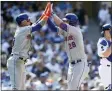  ?? ALEX GALLARDO - THE ASSOCIATED PRESS ?? New York Mets’ J.D. Davis, center, celebrates his two-run home run with Javier Baez, left, as Los Angeles Dodgers catcher Will Smith looks away during the seventh inning of a baseball game in Los Angeles, Sunday, Aug. 22,
2021.