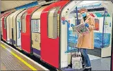  ?? AFP ?? A woman wearing personal protective equipment stands aboard a London Undergroun­d Tube train on Monday.