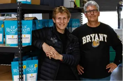  ?? MATTHEW HEALEY FOR THE BOSTON GLOBE ?? Lil’ Rhody Coffee Company founder Vincent Emery (left) with his dad, Patrick Emery, at the company headquarte­rs.