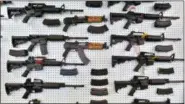  ?? AP PHOTO/BRENNAN LINSLEY, FILE ?? In this July 20, 2014 file photo, guns are displayed for sale by an arms seller east of Colorado Springs, Colo.