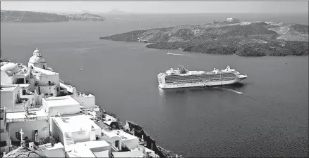  ?? CAMERON HEWITT/RICK STEVES’ EUROPE ?? A cruise ship offers memorable views of the classic whitewashe­d villages of Santorini, Greece.