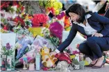  ?? ANDREW HARNIK
THE ASSOCIATED PRESS ?? New York Gov. Kathy Hochul visits a memorial Tuesday at the scene of a mass shooting in Buffalo, N.Y., where 10 people died on Saturday.