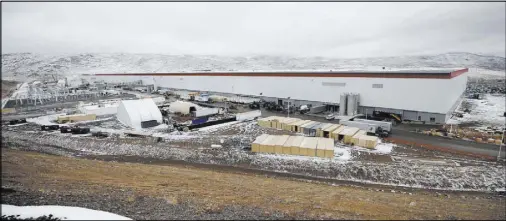  ??  ?? The Tesla Gigafactor­y, east of Reno, employs more than 7,000 people. The facility currently has a 1.9 million-square-foot footprint and boasts 5.5 million square feet of total space.