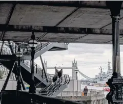  ??  ?? Tower Bridge, which was recently shut for two days by a drawbridge problem, is seen from beneath London Bridge.