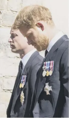  ?? PHOTO: GETTY ?? William and Harry in sombre mood.