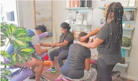  ??  ?? Employees of Quench Wellness, 1319 S. Michigan Ave., provide massages, one of the many services offered at the clinic.