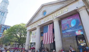  ??  ?? Quincy Market, in the same area as Faneuil Hall, is a fun place to visit. Food stalls, souvenir shops, and music bands create a pleasant youthful vibe.