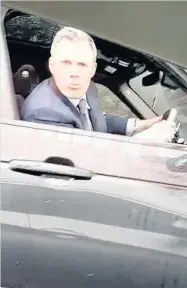 ??  ?? APPALLING Carragher spits at the car. Pic: Daily Mirror