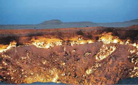  ?? GETTY IMAGES ?? The Door to Hell — a flaming crater in Turkmenist­an — is included in Atlas Obscura, An Explorer’s Guide to the World’s Hidden Wonders.