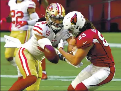  ?? RICK SCUTERI — THE ASSOCIATED PRESS ?? San Francisco 49ers middle linebacker Fred Warner breaks up a pass intended for Cardinals tight end Dan Arnold (85) during the first half on Saturday in Glendale, Ariz.