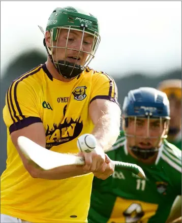  ??  ?? Wexford joint captain Matthew O’Hanlon leaves Ciarán Doyle of Westmeath trailing in his wake.