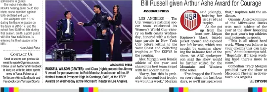  ?? ASSOCIATED PRESS ?? RUSSELL WILSON (CENTER) and Ciara (right) present the Jimmy V award for perseveran­ce to Rob Mendez, head coach of the JV football team at Prospect High in Saratoga, Calif., at the ESPY Awards on Wednesday at the Microsoft Theater in Los Angeles.