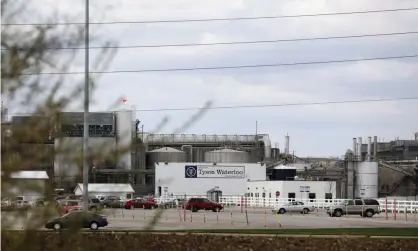  ??  ?? The Tyson Foods pork processing plant in Waterloo, Iowa. Many workers at American meat plants have fallen ill with coronaviru­s. Photograph: Brenna Norman/Reuters