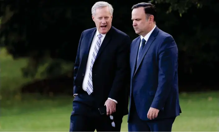  ?? Photograph: Andrew Harnik/AP ?? Mark Meadows (left) and Dan Scavino outside the White House in September 2020.