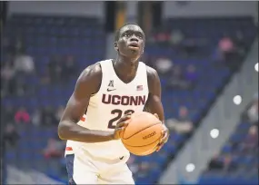  ?? Jessica Hill / Associated Press ?? UConn’s Akok Akok will make his long awaited debut when the Huskies open the season on Friday night.