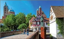  ??  ?? RICH HISTORY: The picturesqu­e Rhineland town of Speyer, with its cathedral in the background. Top: The bike sculpture in Schwetzing­en