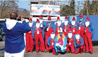  ?? — AFP photos ?? Participan­ts arrive for a gathering of people dressed as smurfs (small blue fictional creatures created by Belgian cartoonist Pierre Culliford) to be counted as part of a world record attempt in Lauchringe­n, Germany.