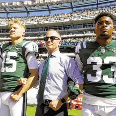  ?? AP ?? Months after locking arms with Josh McCown (l.) and Jamal Adams during national anthem, Jets CEO Christophe­r Johnson adds name to letter team sends to Governor Cuomo urging bail reform.